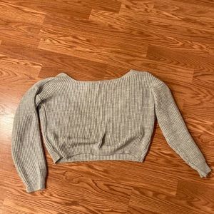 In the style backless sweater!